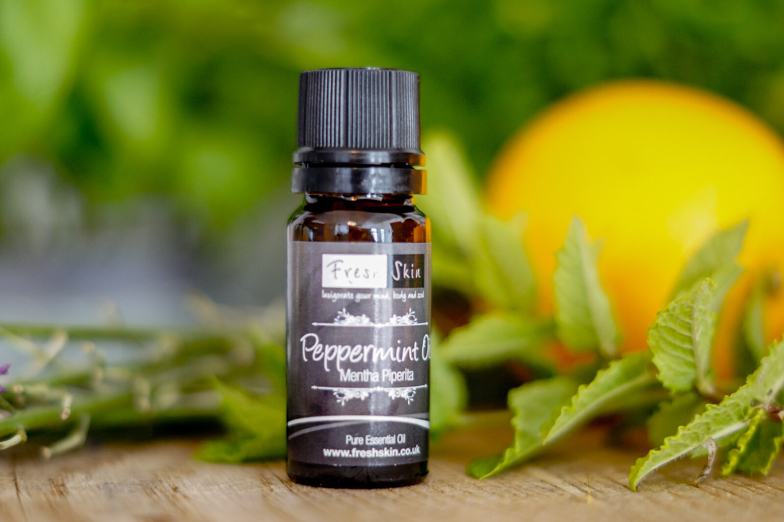 Peppermint Oil bottle with fruit
